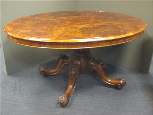 Lot 409 - A Victorian walnut oval breakfast table 73 x...