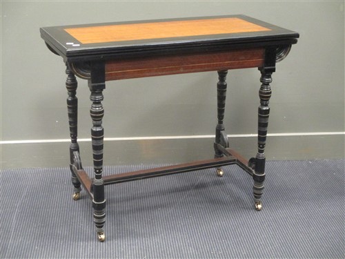Lot 378 - An Aesthetic period ebonised and teak fold...