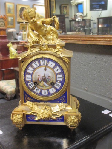 Lot 108 - A 19th century French ormolu clock