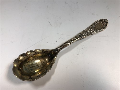Lot 237 - An American metalwares conserve spoon by Tiffany