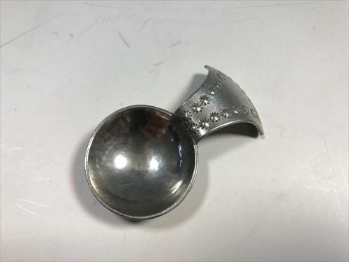 Lot 101 - A white metal caddy spoon by The Keswick School of Industrial Arts