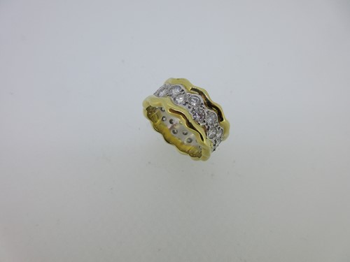 Lot 141 - An unusual diamond full hoop band ring