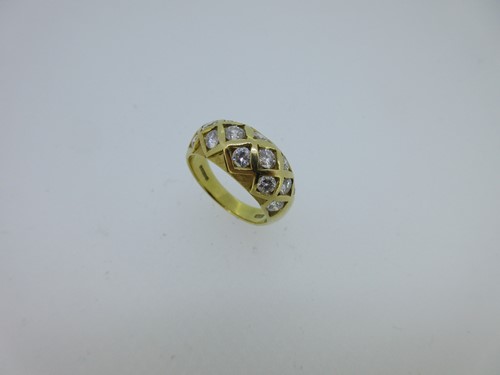 Lot 7 - An 18ct gold and diamond set chequerboard bombé ring