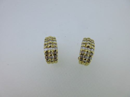 Lot 49 - A pair of French 18ct gold and diamond earrings