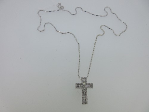 Lot 152 - A diamond cross set in 18ct white gold with associated chain