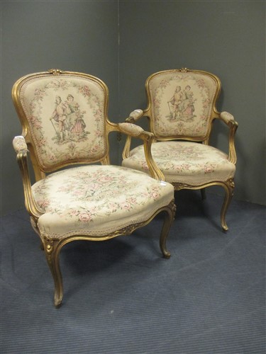 Lot 455 - A pair of French gilt armchairs