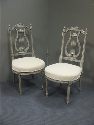 Lot 383 - A pair of Louis XVI painted salon chairs, with...