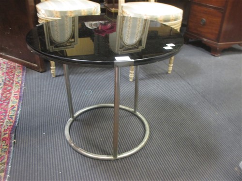 Lot 485 - A small modern glass topped occasional table