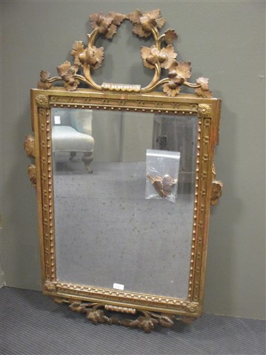 Lot 414 - A Louis XVI gilt framed wall mirror with leaf...
