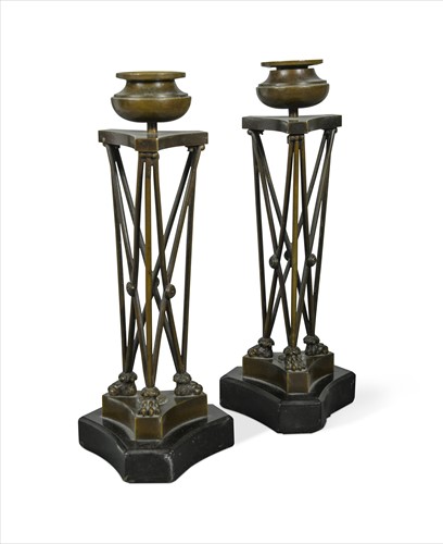 Lot 240 - A pair of Regence bronze candlesticks in the manner of Thomas Hope, early 19th century