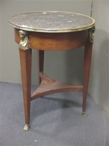 Lot 469 - A French Empire marble top table ambulante,...