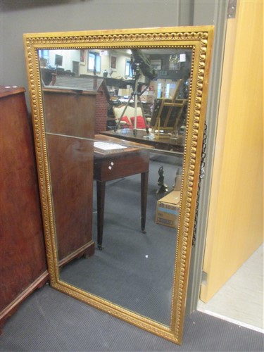 Lot 451 - A large gilt framed wall mirror, in 18th...