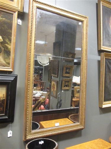 Lot 473 - A large gilt framed mirror, with beaded and...