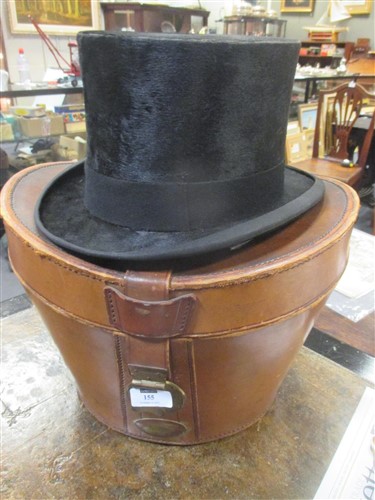 Lot 155 - A silk top hat by Austin Reed Ltd, Regent St,...