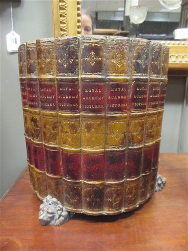 Lot 140 - A waste paper bin designed as leather bindings;...