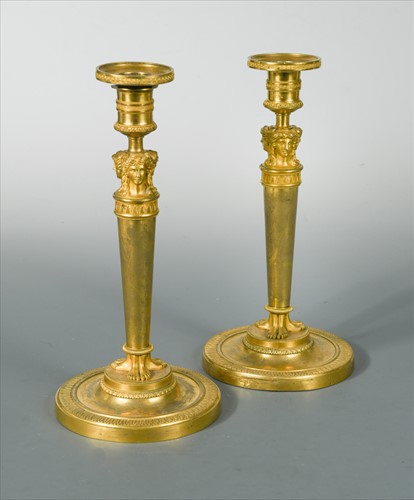 Lot 242 - A pair of French 19th century gilt-bronze candlesticks in the manner of Claude Galle