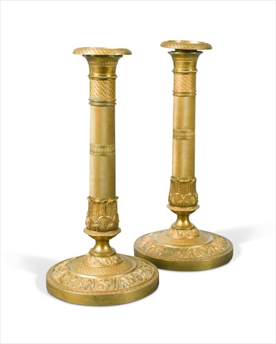 Lot 241 - A pair of Charles X gilt bronze candlesticks