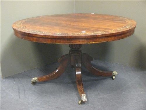 Lot 395 - A Regency rosewood circular pedestal breakfast table