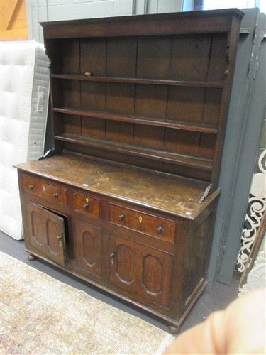 Lot 433 - An 18th century oak dresser with drawers and...