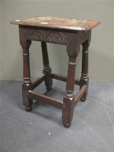 Lot 435 - An antique oak joined stool with later top and...