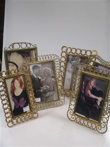 Lot 122 - Four decorative brass photograph frames, late...