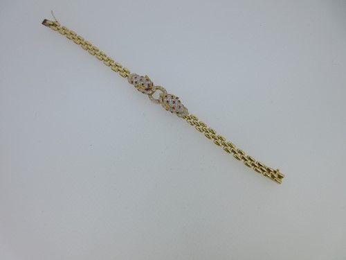 Lot 249 - A diamond and ruby set panther bracelet