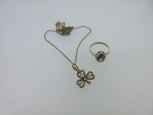 Lot 102 - A seed pearl shamrock pendant and an amethyst and seed pearl ring