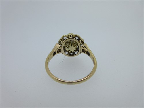 Lot 104 - A cultured pearl and diamond cluster ring