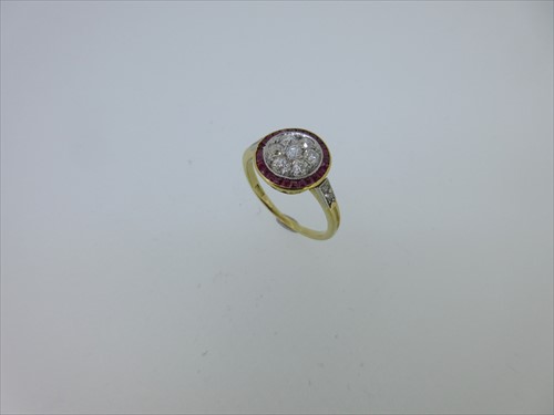 Lot 246 - A ruby and diamond target cluster ring