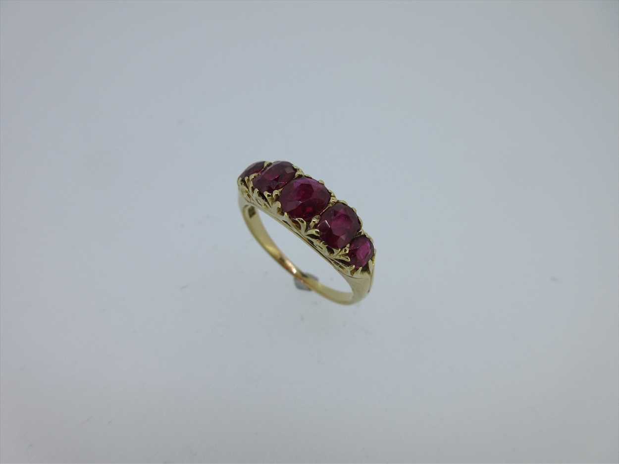 Lot 245 - A five stone ruby ring