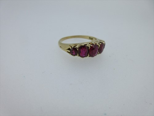 Lot 245 - A five stone ruby ring