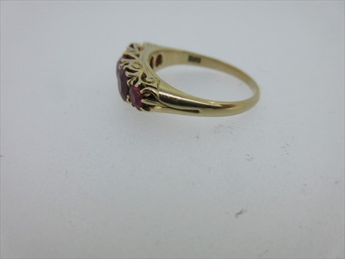 Lot 245 - A five stone ruby ring