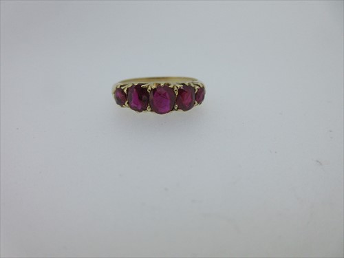 Lot 245 - A five stone ruby ring
