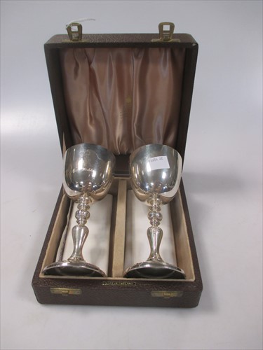 Lot 250 - A pair of silver goblets