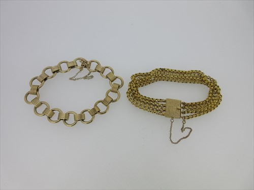 Lot 57 - Two fancy link gold bracelets