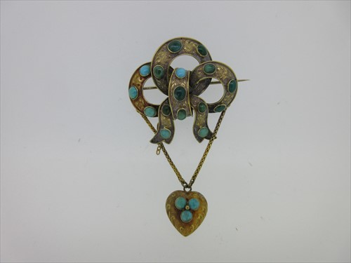 Lot 76 - A Victorian turquoise set knot brooch with pendant heart