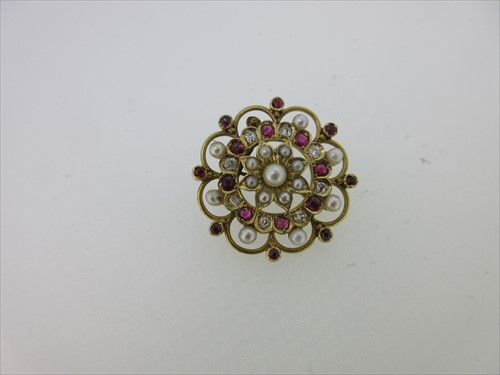 Lot 248 - A ruby, diamond and seed pearl flower brooch