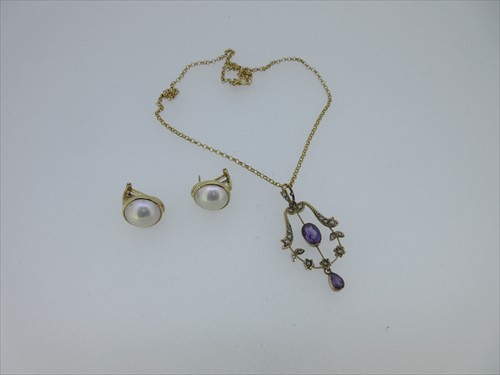 Lot 220 - An Edwardian amethyst and seed pearl pendant with chain, and a pair of mabé pearl earstuds