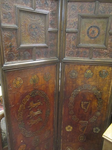 Lot 457 - An Arts & Crafts leather three fold screen