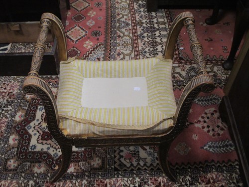 Lot 461 - A George III style carved gilt wood stool, of...