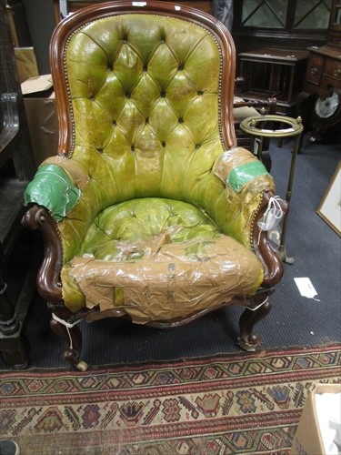 Lot 550 - A Victorian walnut green leather button-back...
