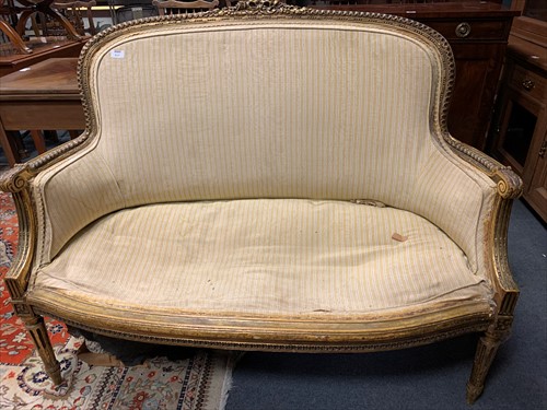 Lot 637 - A Louis XVI style carved gilt gesso canape...