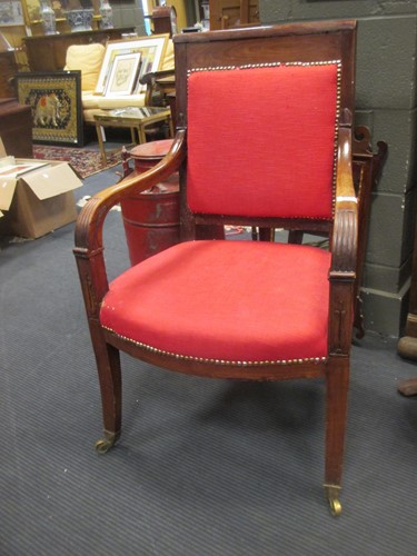 Lot 512 - A French Empire carved mahogany dining...
