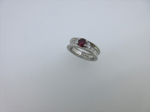 Lot 243 - A ruby, diamond and platinum ring