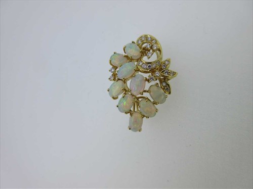Lot 259 - An opal and diamond 'bunch of grapes' brooch / pendant