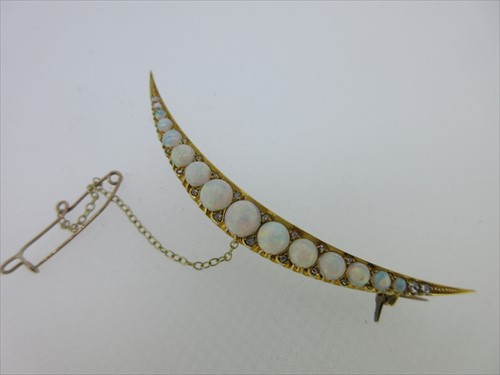 Lot 48 - An opal and diamond open crescent brooch