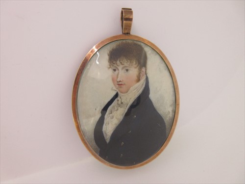 Lot 192 - A portrait miniature attributed to Adam Buck, mounted in a pendant with hairwork reverse