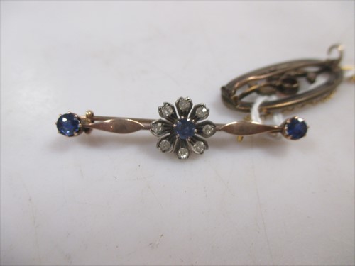 Lot 192 - A sapphire and diamond set bar brooch