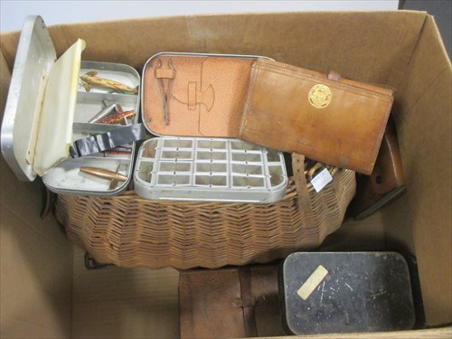 Lot 32 - A wicker fishing reel with various leather,...