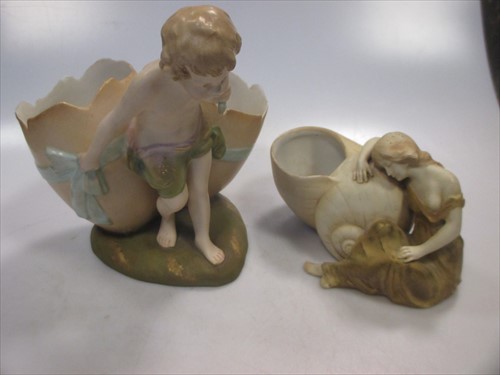 Lot 24 - A Royal Vienna porcelain figure of a boy dragging a shell and another